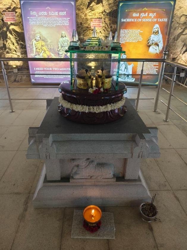 Sacred cave shrine with deity on an ornate pedestal